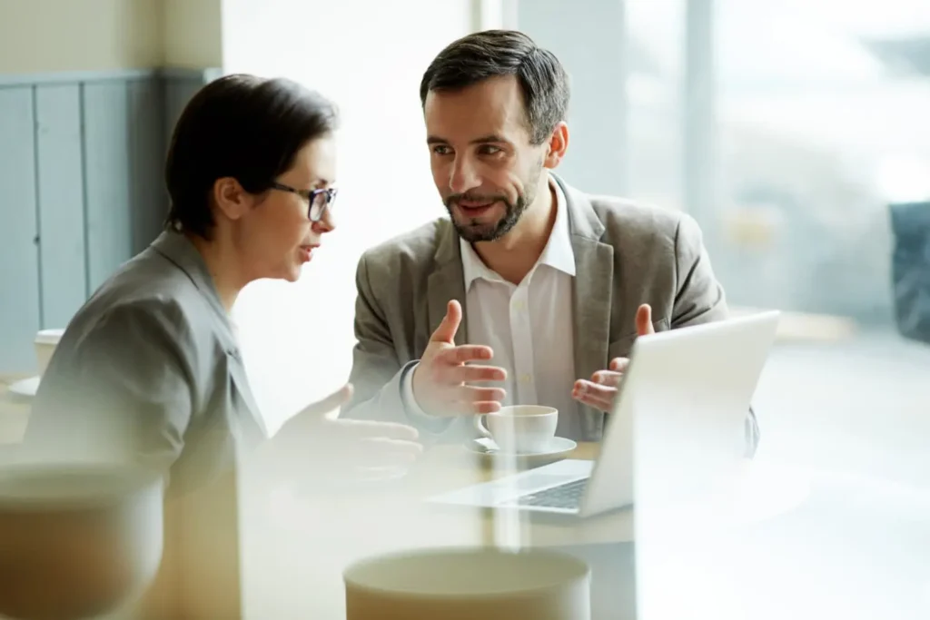 Corporate professionals analyzing client financial data and project plans